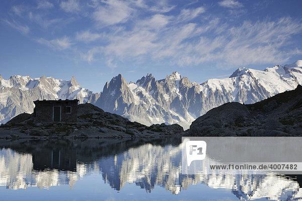 The Aiguilles de Chamonix mountains reflected in Lac Blanc lake  far right Mont Blanc  Haute-Savoie  France  Europe