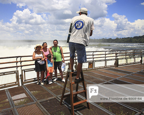 Local tourists photographer at the Garganta del Diablo  Iguazu Falls  Iguazu  Argentinian side  Misiones Province  Argentina