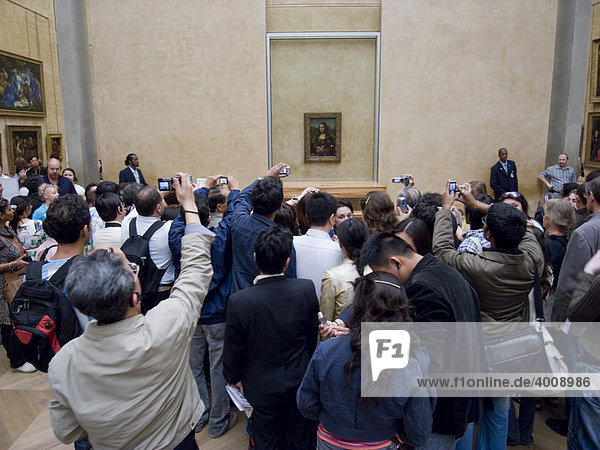 Tourists photographing the Mona Lisa by Da Vinci in the Louvre  Paris  France  Europe