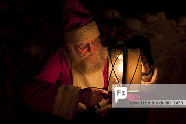 Santa Claus with a lamp in Lapland  Sweden  Scandinavia  Europe
