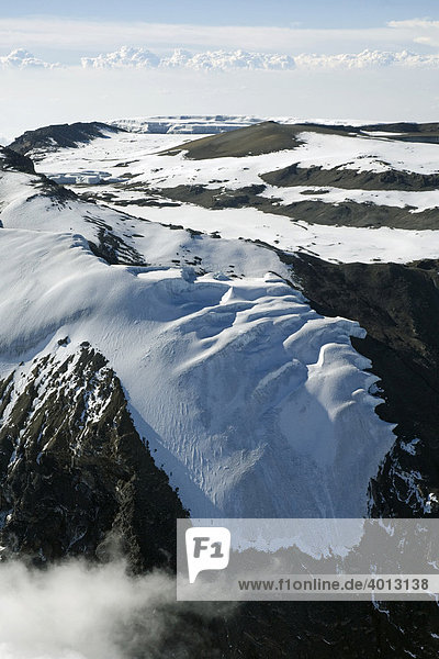 Aerial view of Mt. Kilimanjaro 19335 ft. or 5895 m  Rebmann Glacier in the foreground  summit ridge and crater floor  Tanzania  Africa