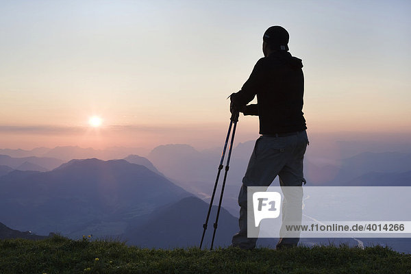 Hiker looking at mountains after sunset  Rofan Range  North Tyrol  Austria  Europe