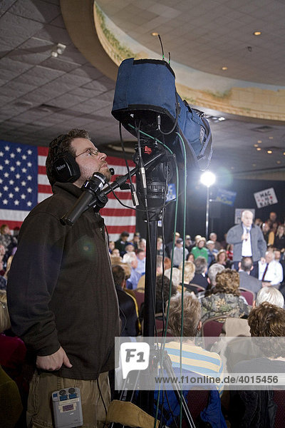 A television camera operator at a John McCain presidential campaign rally  Warren  Michigan  USA