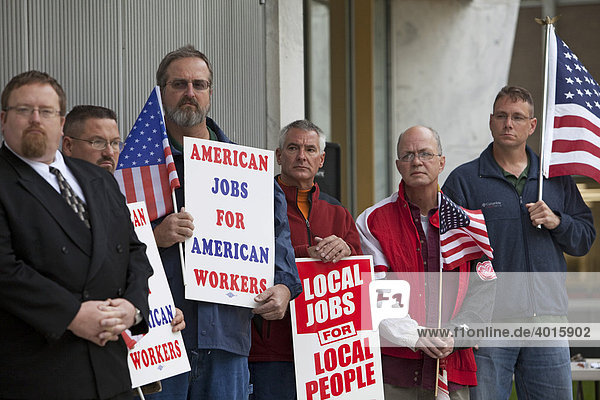 A rally outside the Oakland County government complex supports a proposal to require government contractors to use the federal E-Verify database to check the immigration status of job applicants  Pontiac  Michigan  USA