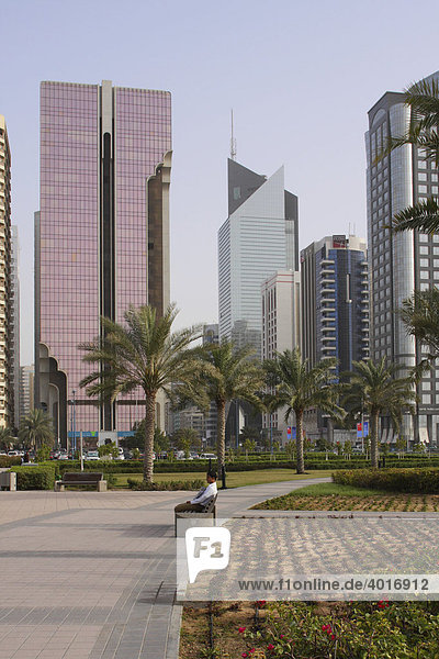Highrise buildings with Emirates Towers at back  Dubai  United Arab Emirates
