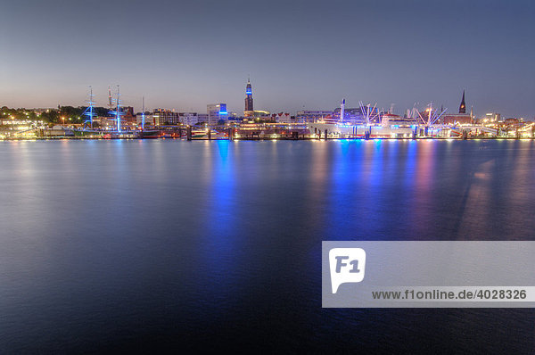 Blue illuminated harbour bank in Hamburg  Germany  Europe