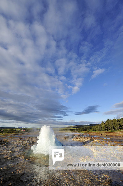 Geyser Strokkur eruption of fountains  ejected water spouts  sequence of 4 shots  geyser  Iceland  Europe