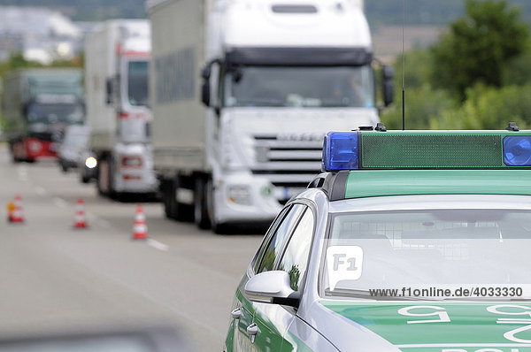 Police car in front of trucks  traffic jam after a road accident on a freeway  Altingen  Baden-Wuerttemberg  Germany  Europe