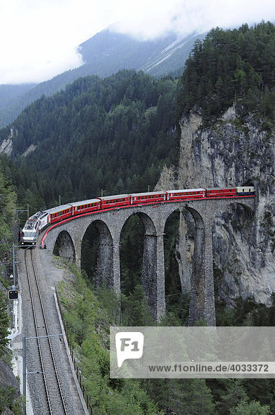 RhB Rhaetian Railway train crossing the Landwasser Viaduct near Filisur Albula section Filisur Graubuenden Switzerland Europe