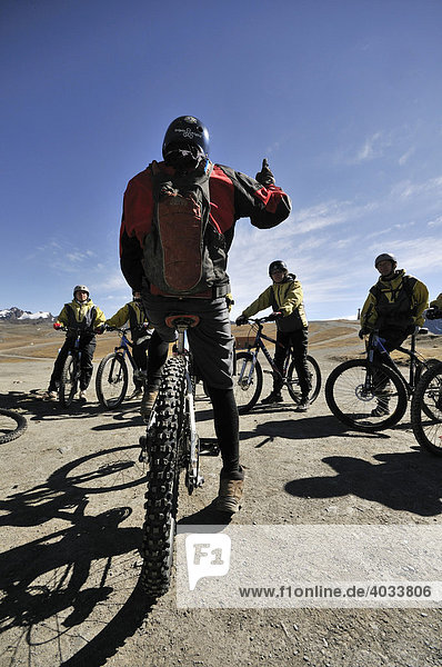 Leader instructing a group of mountainbikers before the descent  Deathroad  La Paz  Bolivia  South America