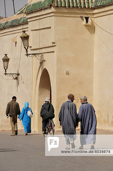 Street scene in front of the Ben Youssef Mosque in the medina quarter of Marrakesh  Morocco  Africa