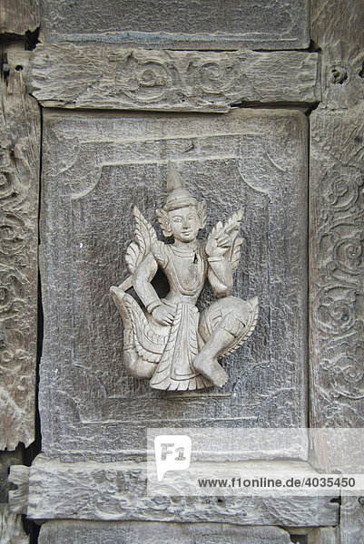 Carved figure on a teak door  Monastery Shwe In Bin Kyaung  Mandalay  Burma  Myanmar  Southeast Asia