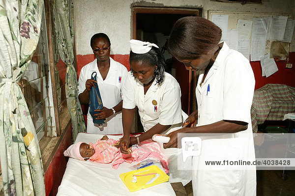 Examination and treatment of an AIDS/HIV infant in a hospital in Manyemen  Cameroon  Africa