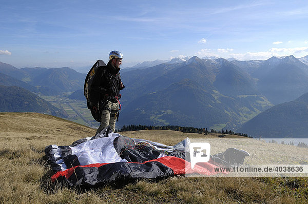 Paraglider preparing for takeoff  Monte Cavallo  Sterzing  Province of Bolzano-Bozen  Italy  Europe