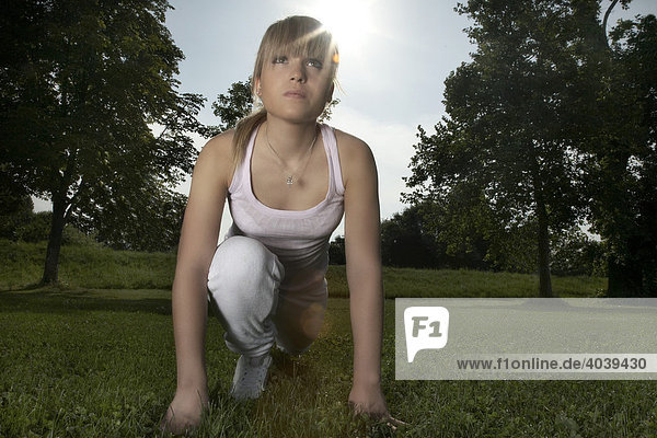 Young  dark blond woman stretching