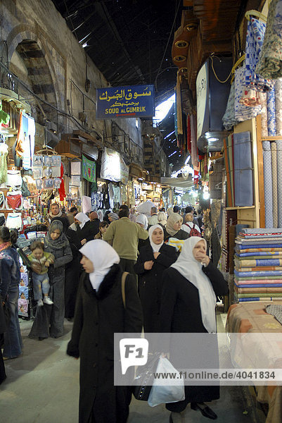Passers-by in the souk in the historic city centre of Damascus  Syria  Middle East  Asia