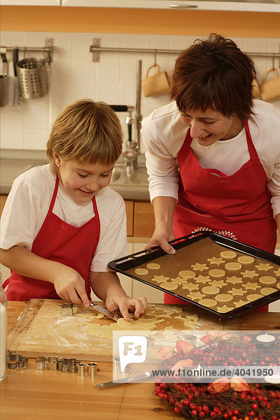 Mother and child baking Christmas cookies