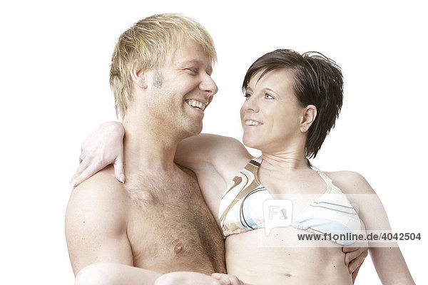 Blonde man and dark-haired woman wearing swimming costumes