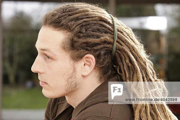 A man with rastafarian hair  dreadlocks  profile