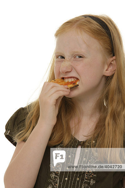 Girl  8  biting heartfully into a piece of pizza