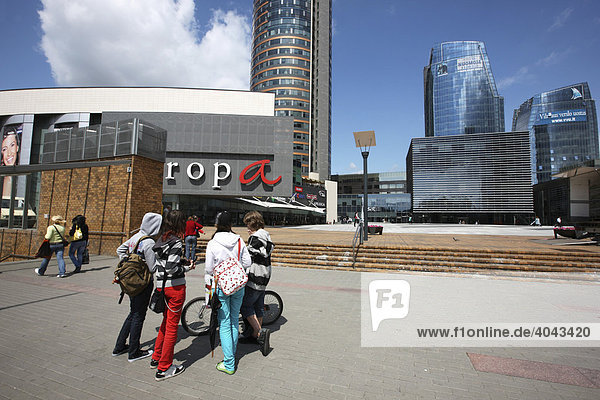 Pedestrians in front of the Europos Centre  a shopping complex  office buildings  business district  and recreation and entertainment area in Vilnius  capital of Lithuania  Baltic States  North East Europe