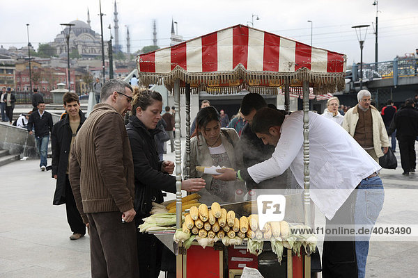 Snack stall selling steamed corn on the cob  Galata Bridge  Istanbul  Turkey