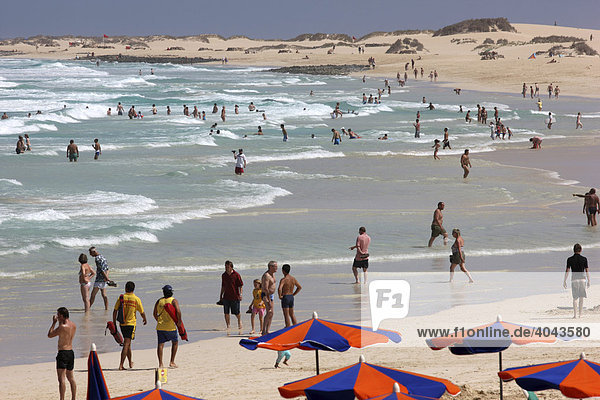 Beach with sand dunes and holidaymakers  Grandes Playas  near Corralejo in the north of the island of Fuerteventura  Canary Islands  Spain  Europe