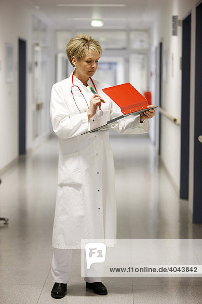 Female doctor in a hospital ward corridor