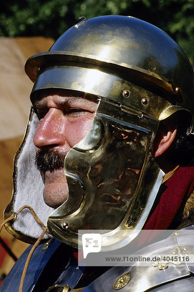 Man with the helmet of a roman legionaire  portrait  roman convention at the Xanten Archaeological Park  Lower Rhine  North Rhine-Westphalia  Germany  Europe