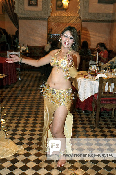 Belly dancer dancing in a Moroccan restaurant  Ksar El Hamra  Medina  Marrakesh  Morocco  North Africa