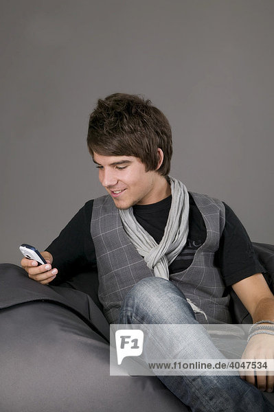Young man using his mobile phone