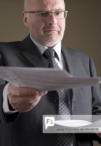 Businessman giving out papers
