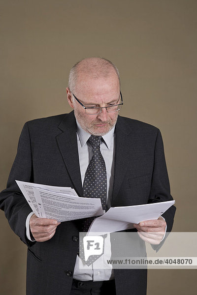 Businessman looking at papers