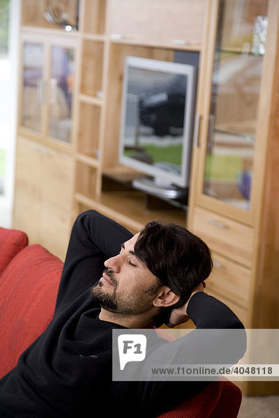 Man sitting on a sofa  relaxing