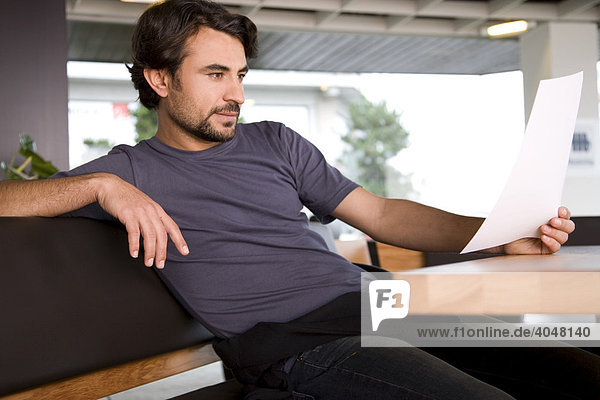 Man reading a letter