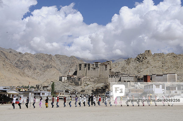 Ladakhi pupils training the march after an Indian school tradition in front of Leh Palace  Ladakh  North India  Himalaya  Asia