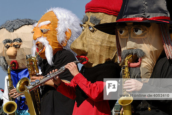 Group of musicians called Sax Puppets performing with fanciful masks  Kiel Week 2008  Kiel  Schleswig-Holstein  Germany  Europe