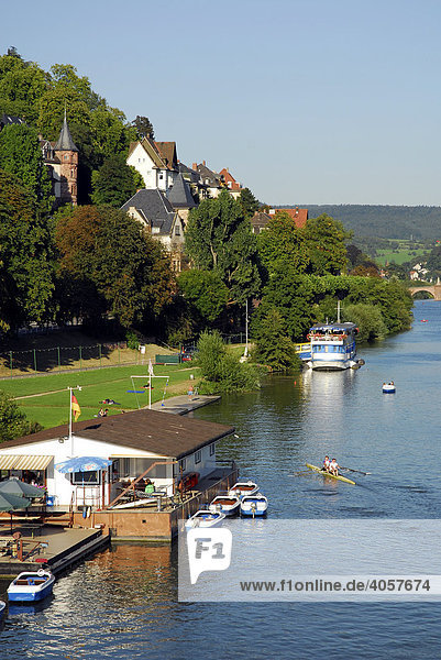 Boat rental on towpath  elegant residential area at the hillocked river side in the back  Heidelberg  Neckar Valley  Baden-Wuerttemberg  Germany  Europe