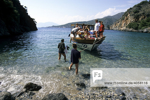 Boat on a beach in a bay between Dalyan and Sarigerme  Mugla Province  Mediterranean  Turkey