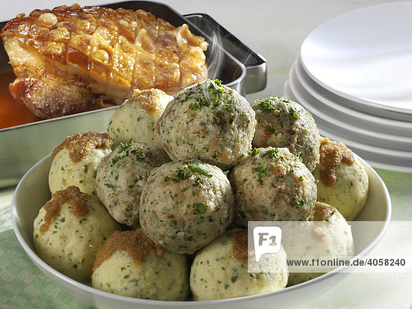 Potato dumplings and bread dumplings with roast pork
