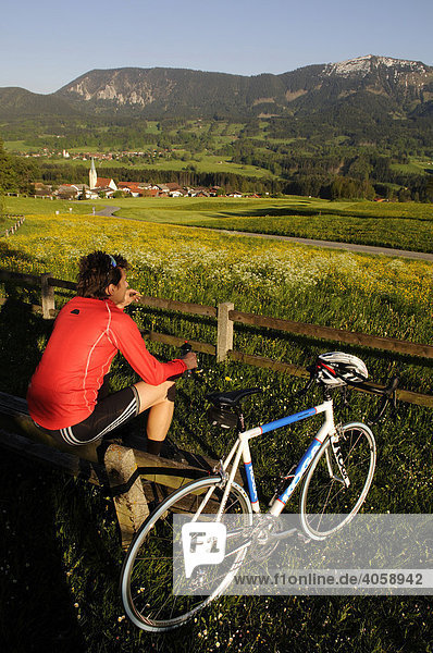 Racing cyclists taking a break  Toerwang  Chiemgau  Bavaria  Germany  Europe