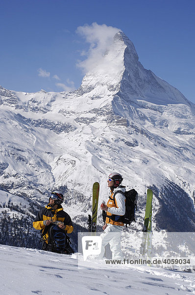 Skiers  Freeriders carrying skis to Rothorn  Mount Matterhorn  Zermatt  Wallis  Switzerland  Europe
