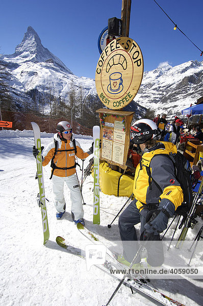 Skiers in front of the Chemi-Hitta mountain hut  Matterhorn Mountain  Zermatt  Valais or Wallis  Switzerland  Europe