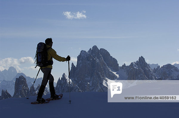 Snowshoeing in front of the Monte Cristallo Massif  Hochpustertal Valley or High Puster Valley or Alto Pusteria  Bolzano-Bozen  Dolomite Alps  Italy  Europe