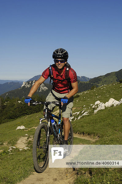 Mountain biker on Kampenwand  Chiemgau  Bavarian Pre-Alps  Bavaria  Germany  Europe
