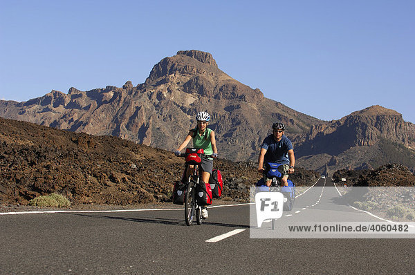 Bicyclists in the Teide National Park  Tenerife  Canary Islands  Spain  Europe