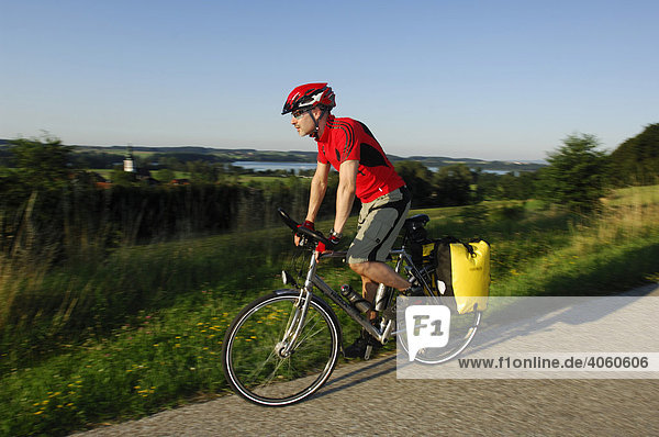 Cyclist at Waging Lake  Chiemgau  Bavaria  Germany  Europe
