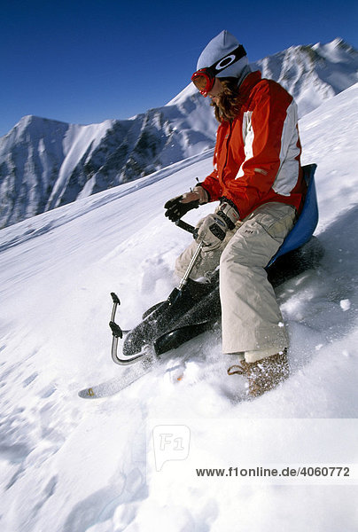 Man going downhill with a snowcart  Serfaus  Tyrol  Austria  Europe