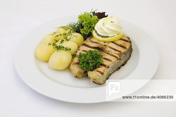 Grilled salmon filet with herb butter  potatoes with parsley