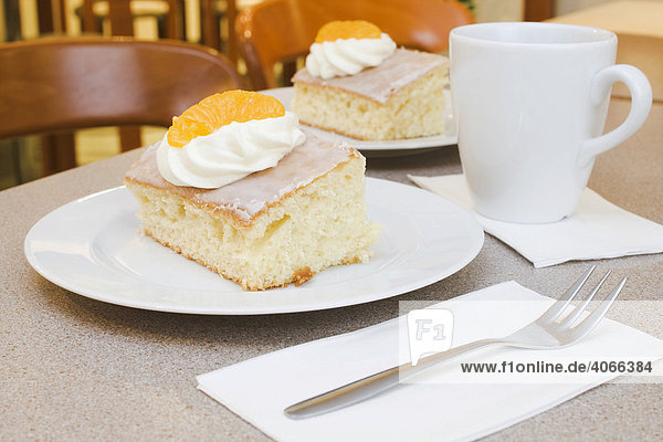 Lemonade cake with cream  mandarine  cup of coffee